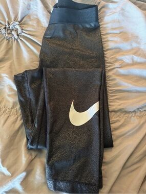 Nike women’s Black glitter Leggings with silver Swoosh